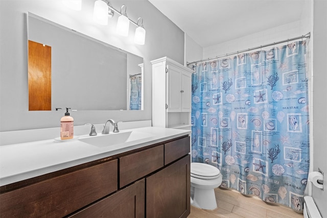 full bath featuring toilet, baseboard heating, wood finished floors, vanity, and curtained shower