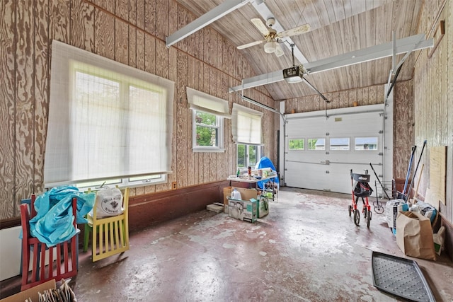 garage featuring a garage door opener and ceiling fan