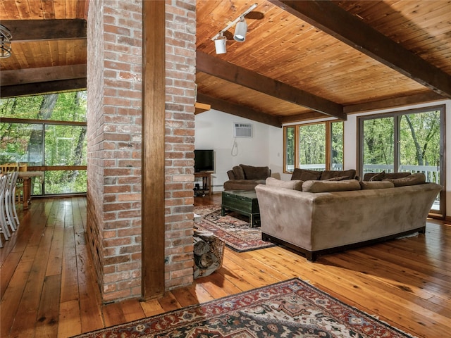 living room featuring wood-type flooring, wood ceiling, healthy amount of natural light, and a wall unit AC