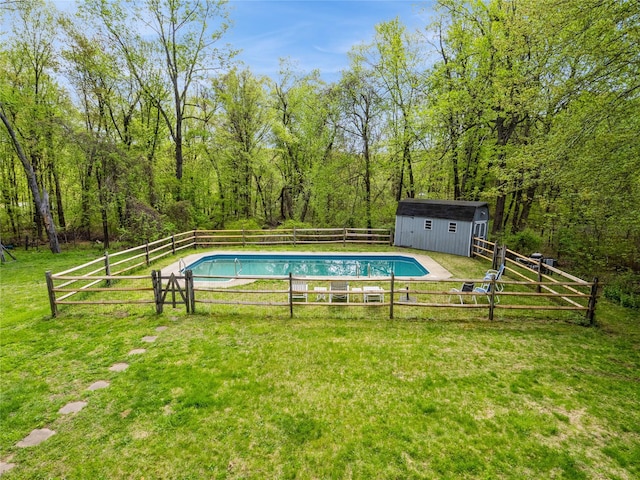 view of pool with an outdoor structure and a storage unit
