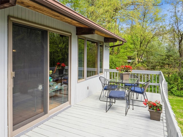 wooden deck with outdoor dining area