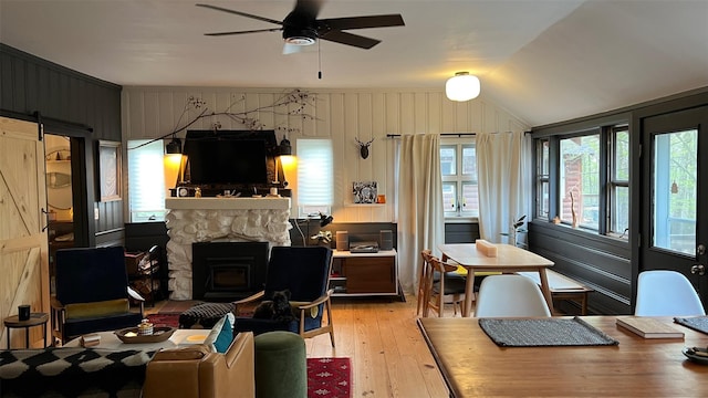 112 E Thompson Pl, Smallwood, NY 12778 - living area featuring ceiling fan, healthy amount of natural light, light wood-style flooring, vaulted ceiling, and a barn door