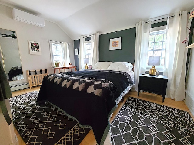 112 E Thompson Pl, Smallwood, NY 12778 - bedroom with a wall mounted AC, multiple windows, baseboard heating, vaulted ceiling, and wood finished floors