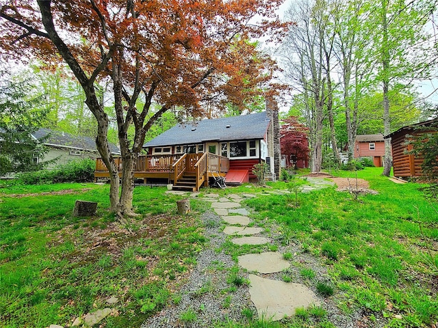 112 E Thompson Pl, Smallwood, NY 12778 - rear view of house with a wooden deck, a yard, and a chimney