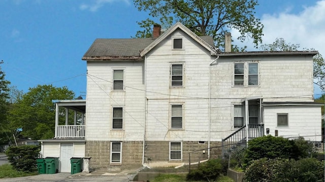view of front of home with a chimney