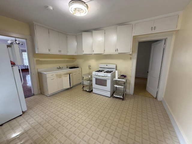 kitchen with white appliances, light countertops, white cabinets, and light flooring