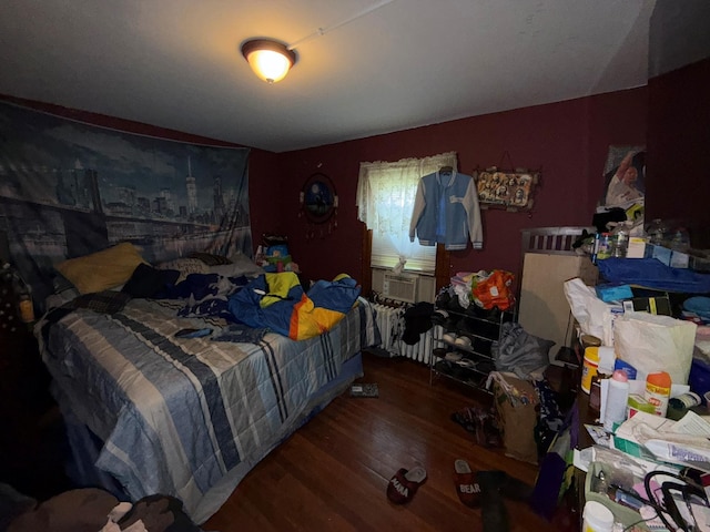 bedroom with wood finished floors