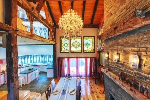 5 Downer Ln, Woodstock, NY 12498 - dining area with beam ceiling, a chandelier, wood ceiling, and high vaulted ceiling