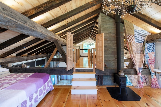 5 Downer Ln, Woodstock, NY 12498 - bedroom with a wood stove, hardwood / wood-style floors, vaulted ceiling with beams, and wood ceiling