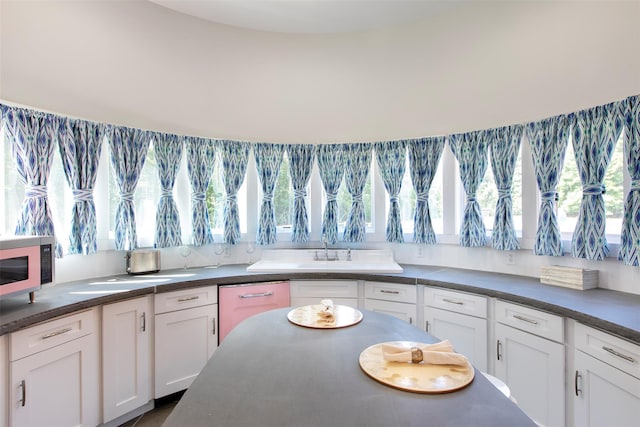 5 Downer Ln, Woodstock, NY 12498 - kitchen with stainless steel microwave, white cabinetry, and dark countertops