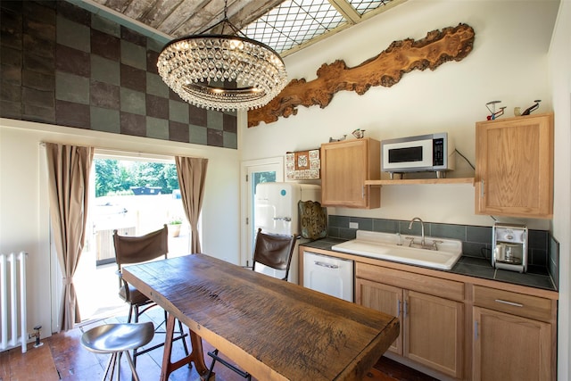 5 Downer Ln, Woodstock, NY 12498 - kitchen with a sink, radiator, white appliances, a chandelier, and light brown cabinets