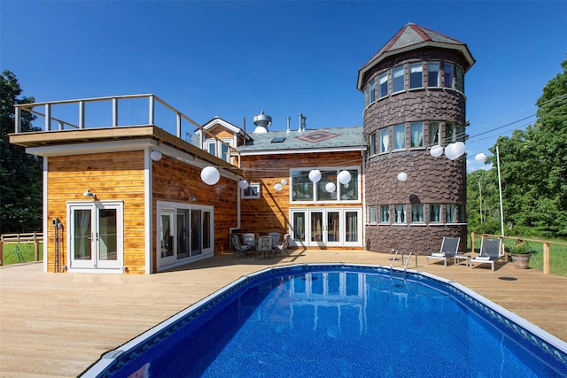 5 Downer Ln, Woodstock, NY 12498 - back of house featuring a deck, a fenced in pool, and french doors