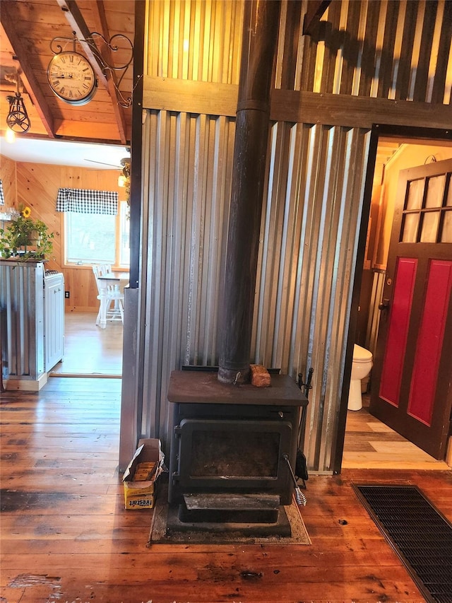51 E Oak St, Smallwood, NY 12778 - detailed view of a wood stove, wood finished floors, and wooden walls