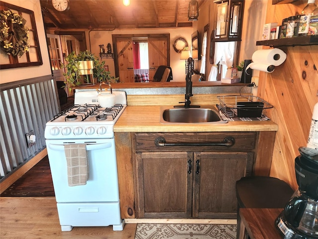 51 E Oak St, Smallwood, NY 12778 - kitchen with white range with gas cooktop, a sink, wooden ceiling, light countertops, and dark brown cabinets