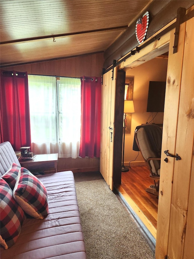 51 E Oak St, Smallwood, NY 12778 - bedroom with vaulted ceiling, a barn door, and wood finished floors