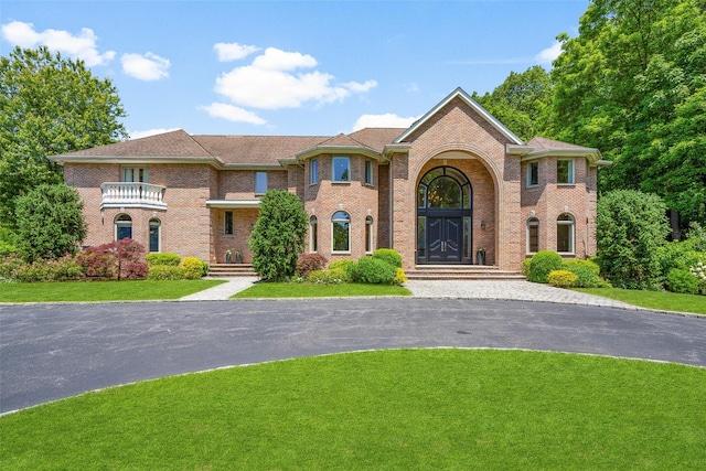 9 Oak Ridge Ct, West Harrison, NY 10604 - colonial-style house featuring brick siding and a front yard