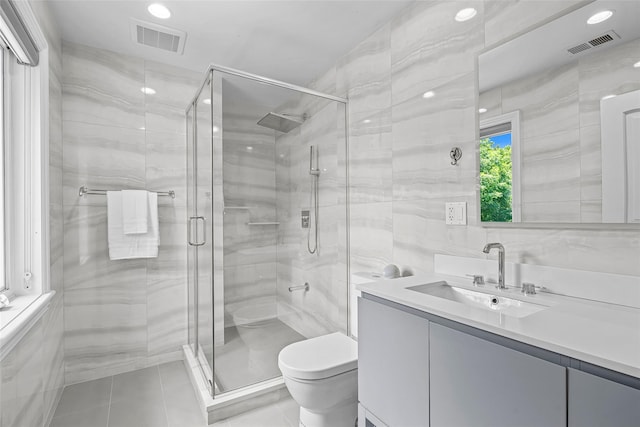 9 Oak Ridge Ct, West Harrison, NY 10604 - full bath with toilet, vanity, a shower stall, tile patterned floors, and tile walls