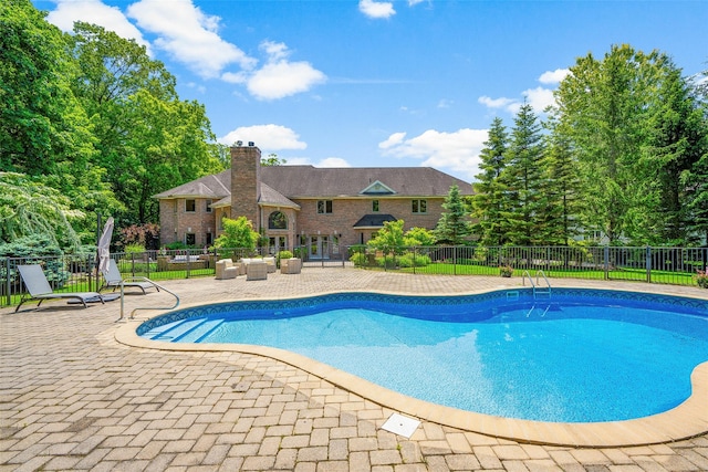 9 Oak Ridge Ct, West Harrison, NY 10604 - view of swimming pool with a patio area