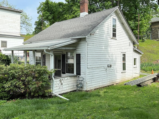 15 Springside Ave, Poughkeepsie, NY 12603 - back of house with a porch, a shingled roof, a yard, and a chimney