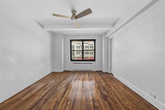 unfurnished room featuring ceiling fan, beamed ceiling, dark wood-type flooring, and baseboards