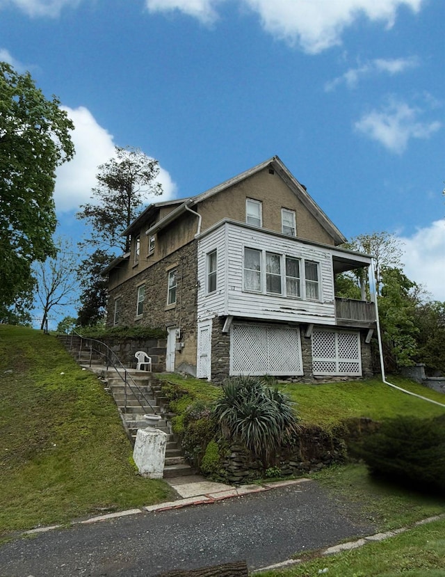 17 Springside Ave, Poughkeepsie, NY 12603 - view of property exterior with stairway, a lawn, and stone siding