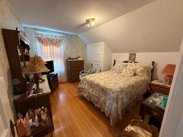 17 Springside Ave, Poughkeepsie, NY 12603 - bedroom with wallpapered walls, light wood-style flooring, and vaulted ceiling