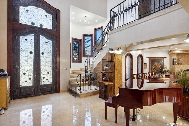 959 S End Rd, Woodmere, NY 11598 - entryway with a towering ceiling, french doors, stairway, and recessed lighting