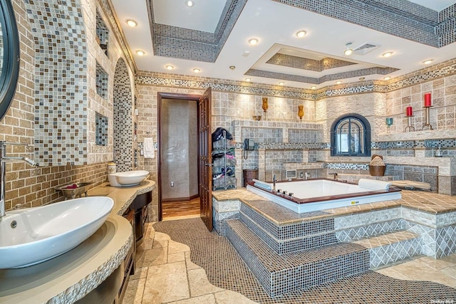 959 S End Rd, Woodmere, NY 11598 - bathroom featuring a sink, tile walls, crown molding, a bath, and stone tile floors