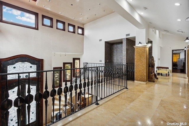 959 S End Rd, Woodmere, NY 11598 - hall featuring a towering ceiling, an upstairs landing, marble tiled floors, recessed lighting, and plenty of natural light