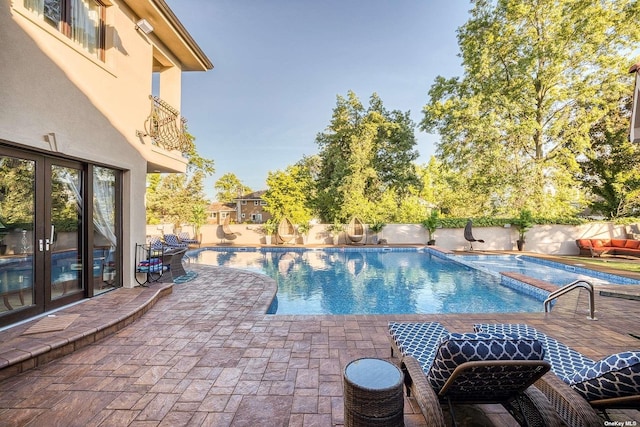 959 S End Rd, Woodmere, NY 11598 - view of pool with french doors, a fenced backyard, a patio area, and a pool with connected hot tub