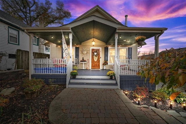 exterior entry at dusk with a porch