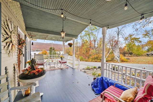 wooden terrace with a porch