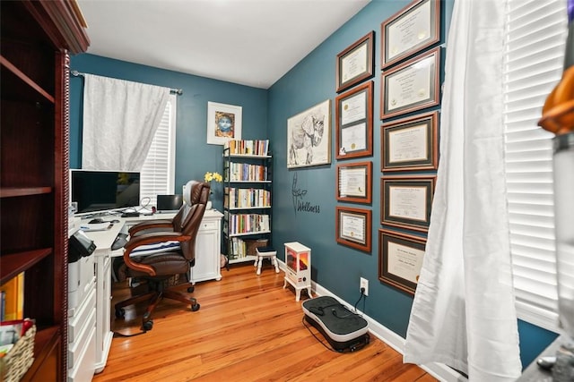 office space featuring wood finished floors and baseboards