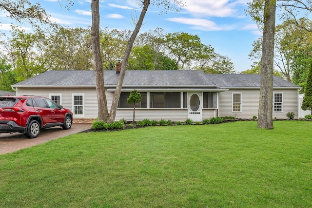 3 Russet Ln, Lake Grove, NY 11755 - single story home featuring driveway, a front lawn, a chimney, a sunroom, and a shingled roof