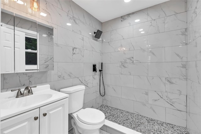 3 Russet Ln, Lake Grove, NY 11755 - full bathroom with vanity, toilet, tile walls, and a tile shower