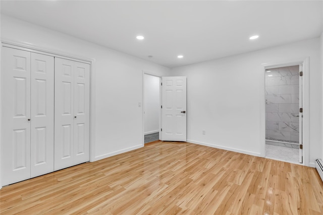 3 Russet Ln, Lake Grove, NY 11755 - unfurnished bedroom featuring light wood finished floors, ensuite bath, baseboards, and recessed lighting