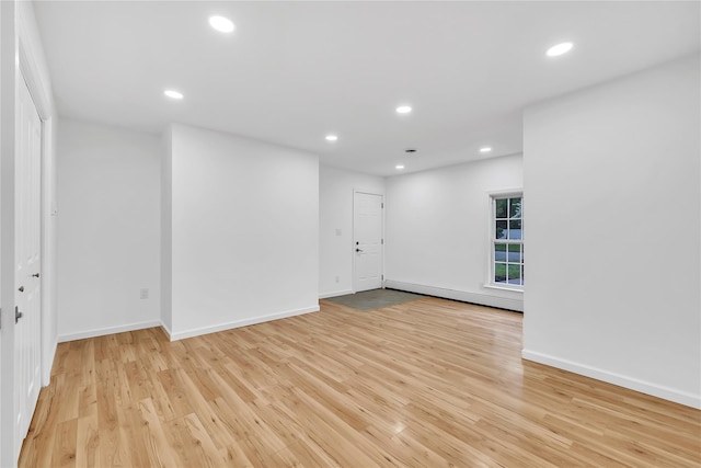 3 Russet Ln, Lake Grove, NY 11755 - spare room with baseboards, a baseboard radiator, light wood finished floors, and recessed lighting