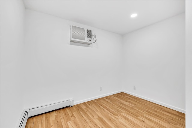 3 Russet Ln, Lake Grove, NY 11755 - empty room with a baseboard radiator, baseboards, light wood-type flooring, and recessed lighting