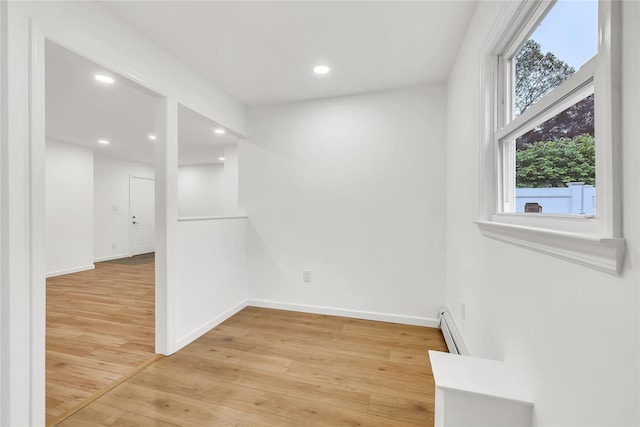 3 Russet Ln, Lake Grove, NY 11755 - empty room with baseboards, light wood-style floors, a baseboard radiator, and recessed lighting