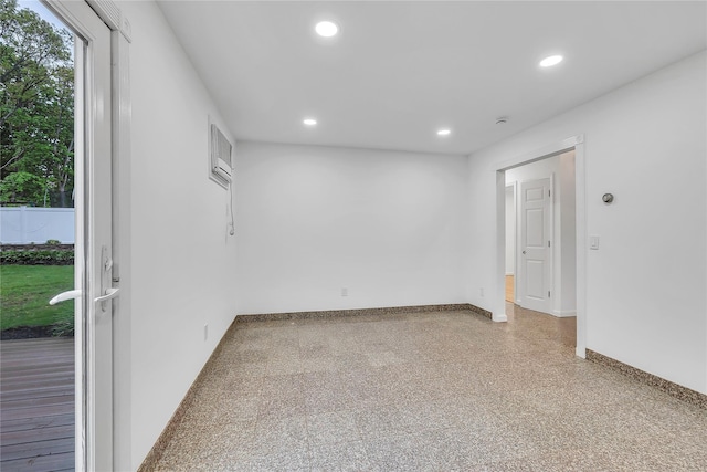 3 Russet Ln, Lake Grove, NY 11755 - empty room featuring speckled floor, baseboards, and recessed lighting