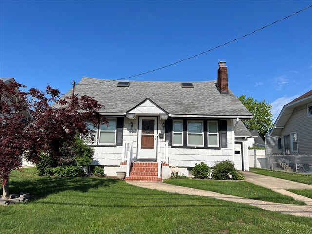 bungalow featuring roof with shingles, a chimney, entry steps, a garage, and concrete driveway