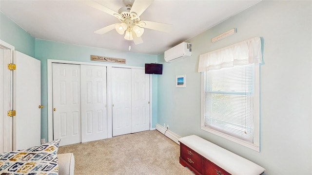 bedroom featuring a wall unit AC, multiple closets, light carpet, a baseboard heating unit, and ceiling fan