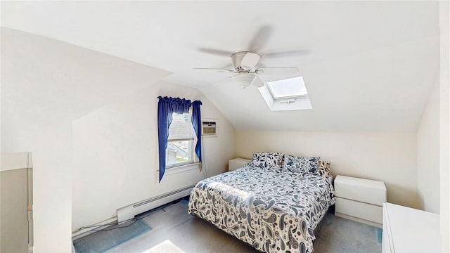 bedroom featuring a baseboard heating unit, a skylight, lofted ceiling, carpet floors, and a ceiling fan