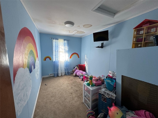 playroom featuring carpet flooring, a baseboard heating unit, and crown molding