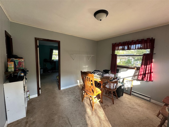 carpeted dining room with a baseboard radiator, baseboards, crown molding, and a wood stove