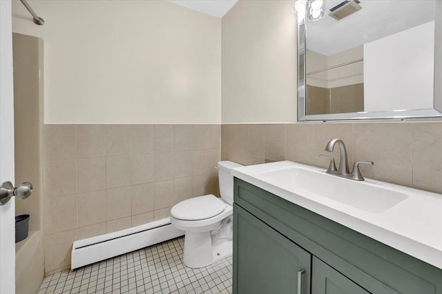 full bathroom featuring tile walls, a baseboard radiator, toilet, walk in shower, and vanity