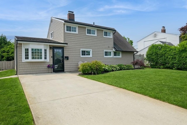 59 Springtime Ln S, Levittown, NY 11756 - back of property featuring a chimney