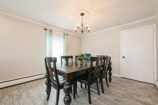 59 Springtime Ln S, Levittown, NY 11756 - dining space featuring a chandelier, light wood finished floors, a baseboard radiator, crown molding, and baseboards