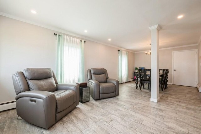 59 Springtime Ln S, Levittown, NY 11756 - living area with plenty of natural light, a chandelier, ornamental molding, recessed lighting, and light wood finished floors