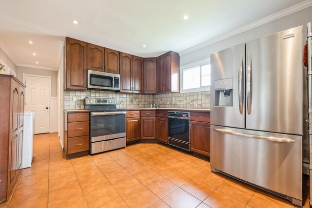 59 Springtime Ln S, Levittown, NY 11756 - kitchen with stainless steel appliances, ornamental molding, decorative backsplash, light tile patterned flooring, and recessed lighting
